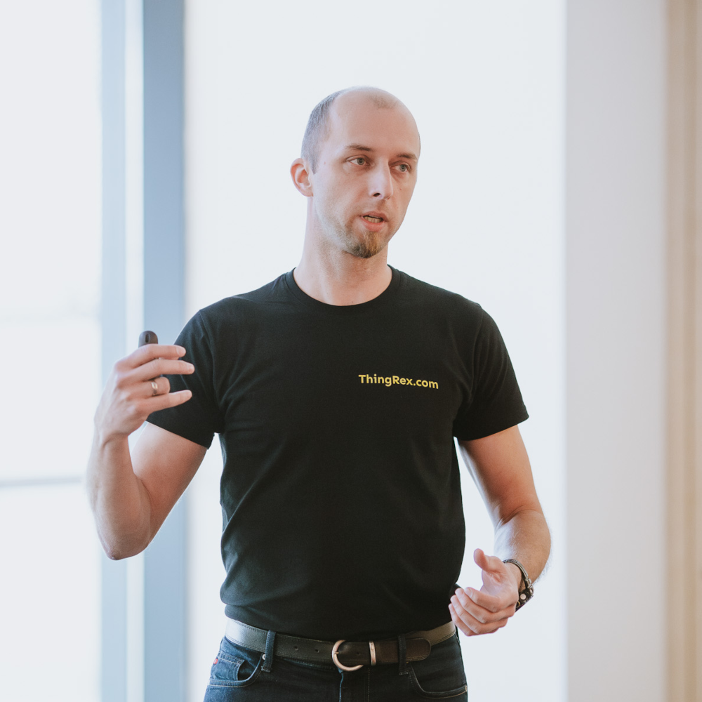 Łukasz Malinowski presenting at a technical talk